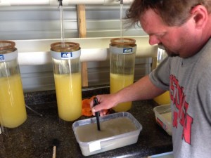 Jim Schmitz stirring in bentonite clay mix