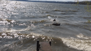 Tom swimming out the anchor and pump system